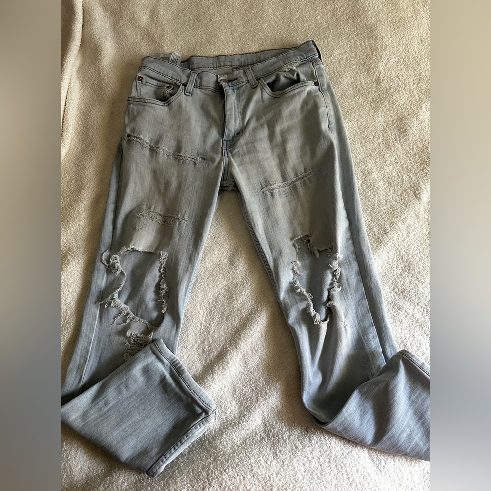 Levi’s 511 denim distressed mid rise jeans